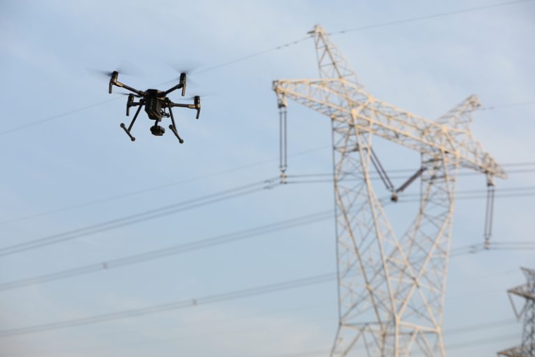 industrial drone inspecting storm damaged power lines