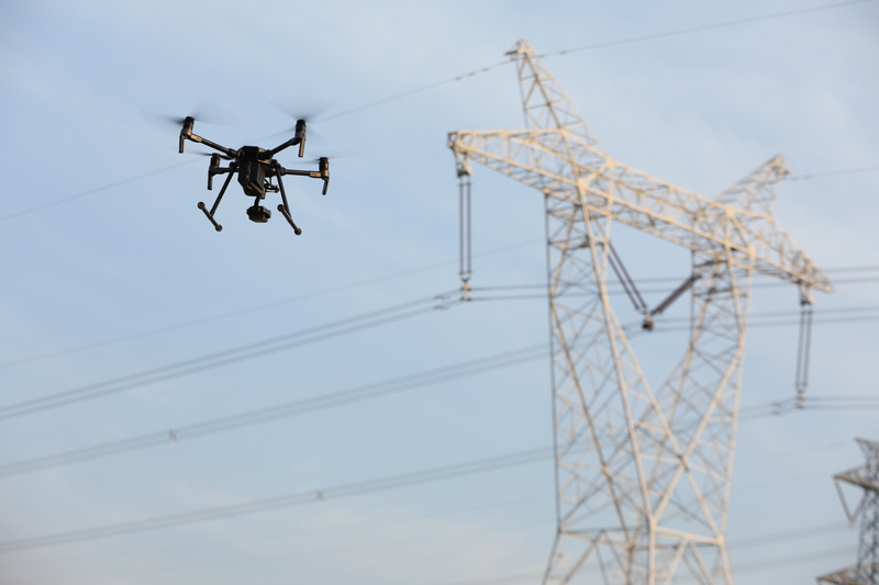 industrial drone inspecting storm damaged power lines