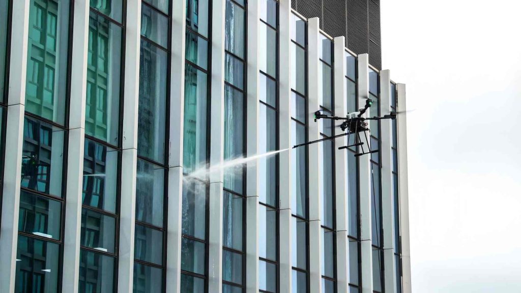 VA-D15R cleaning drone cleaning a high-rise building facade