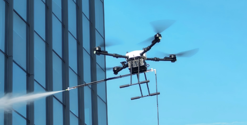 A professional cleaning drone operating on a glass facade